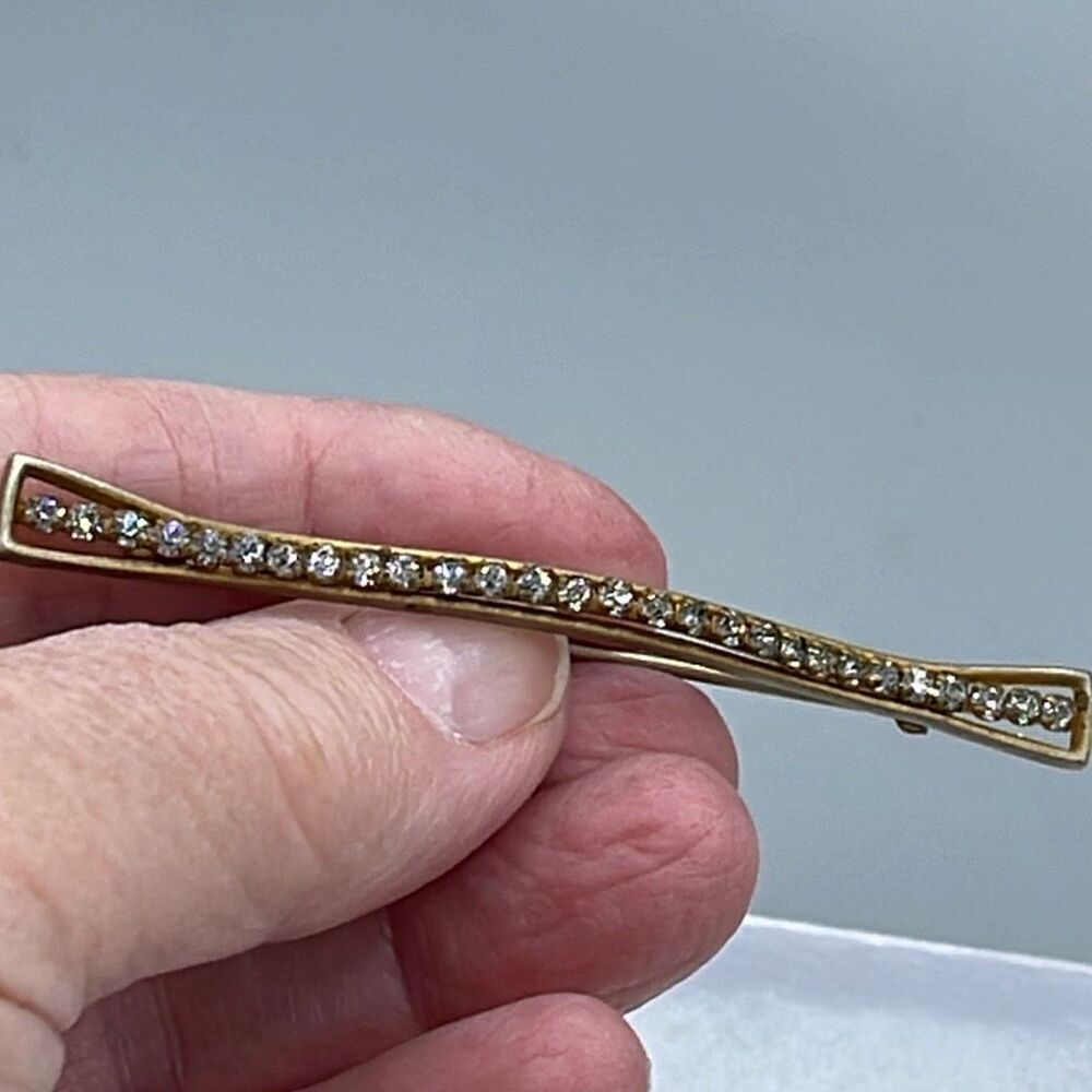 Vintage Art Deco brooch curved and covered in rhinestones.C-clasp
